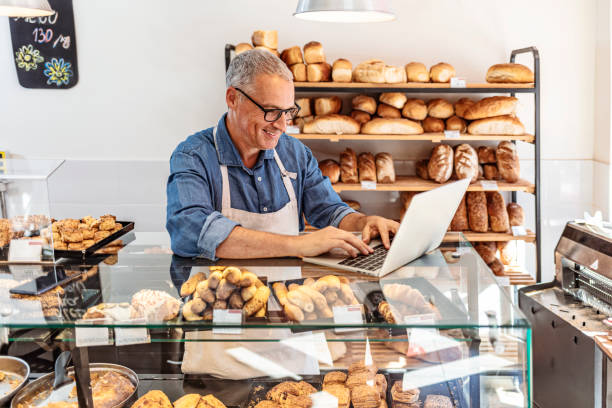 Restaurant staff managing inventory on the laptop - Inventory Cost