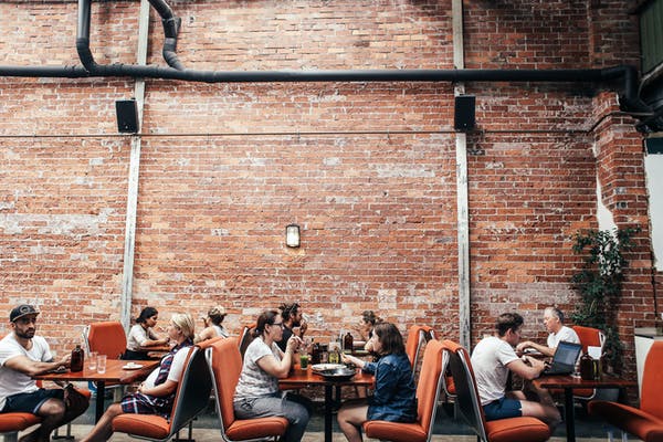 Customers enjoying restaurant experience - get CRM for restaurants. 