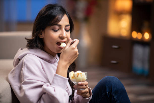 A woman eating ice cream. 